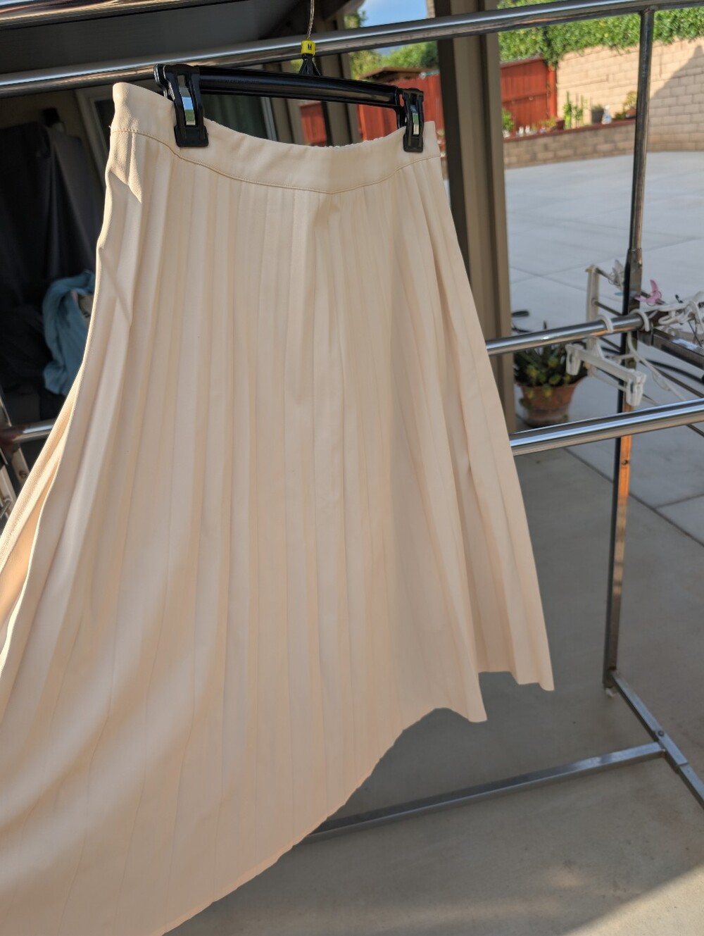 Asymmetrical Pleated Skirt in Cream Faux Leather